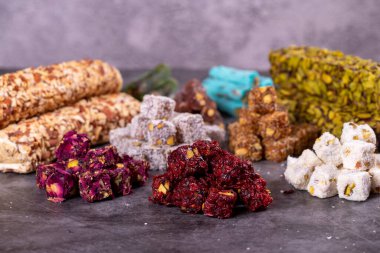 Turkish delight. Traditional Turkish delicacies. Turkish delight varieties on a dark background