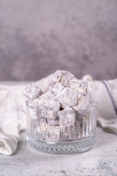 Turkish Delight with Pistachio. Sweet Turkish delight on gray background. Traditional Turkish delicacies. close up