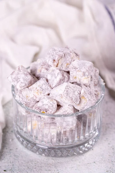 Turkish Delight with Pistachio. Sweet Turkish delight on gray background. Traditional Turkish delicacies. close up