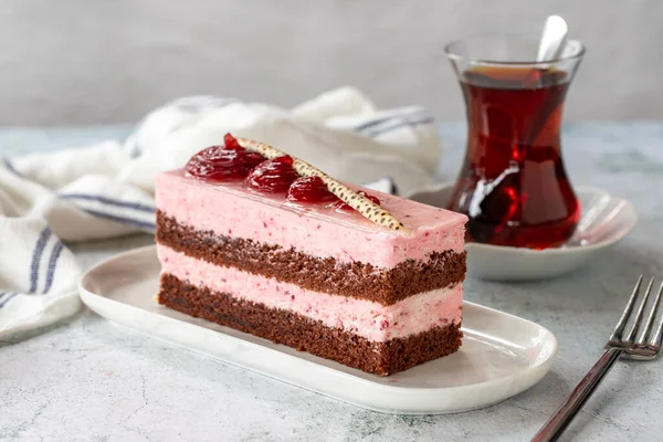 Strawberry flavored cake. Fruit cream cake on gray background. close up