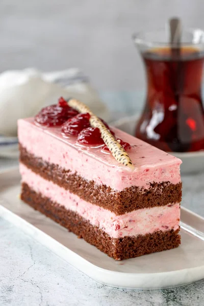 Strawberry flavored cake. Fruit cream cake on gray background. close up