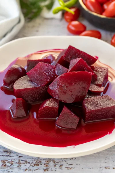 Pickled Red Beetroot. Pickled beetroot on wood background. close up