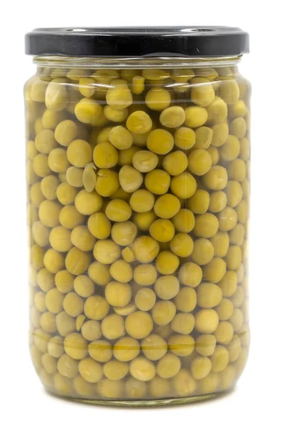 白い背景に隔離されたガラス瓶に缶詰のエンドウ豆 — ストック写真