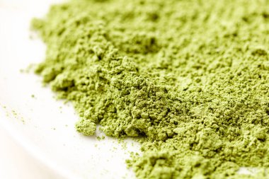 Kibrit çayı. Arkaplan deseni yeşil toz yakın plan. Makro.