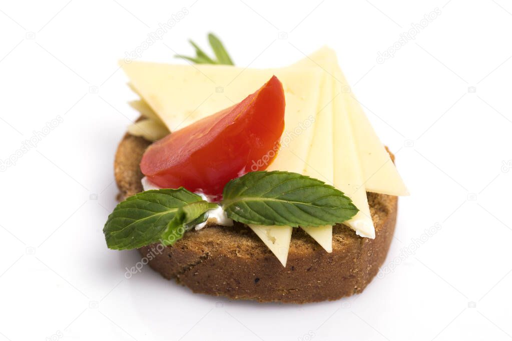 Delicious canapes wiyh feta cheese , strawberrys black sesame and fresh basil leaves isolated on white