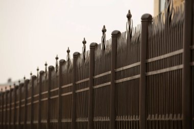 metal fence in a row