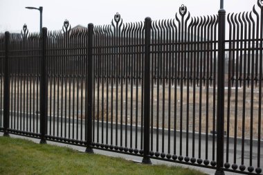 metal fence in a row
