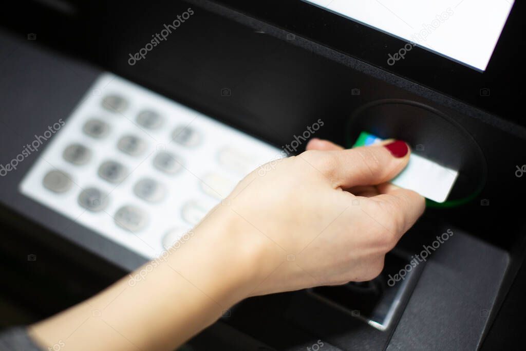 hand of woman holding a credit card