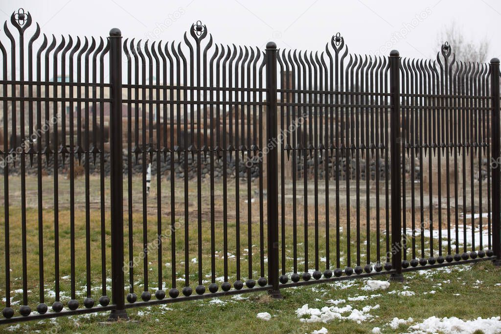 metal fence in a row