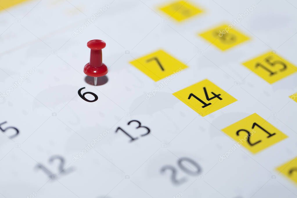 calendar with a pin on a white background