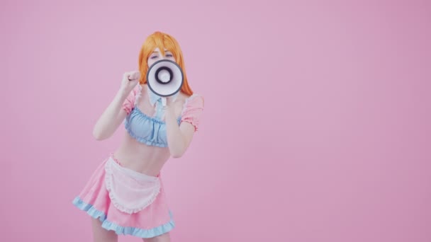 Cute Young Caucasian Cheerleader Cheers Her Team Using Megaphone Medium Long Studio Shot Pink Background — Stock Video