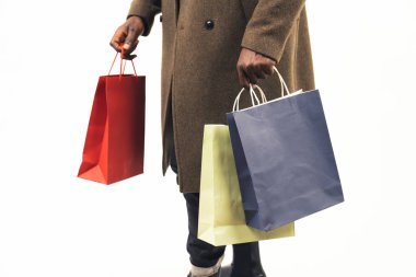 carrying shopping paper bags white background - close-up shot