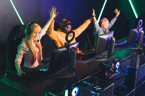 High five. Successful interracial gaming team wins another online battle. Modern leisure time concept. —  Fotos de Stock