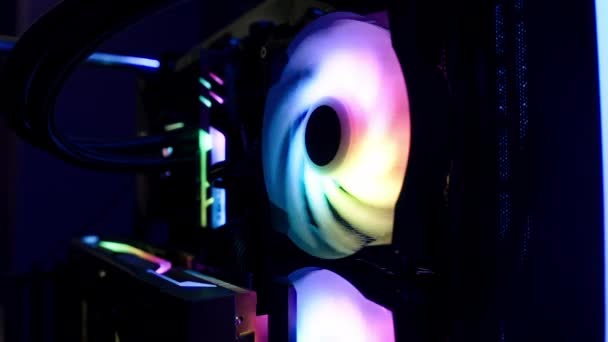 Close-up shot of a colorful bright custom computer cooler with led lights. Insides of a pc. — стоковое видео
