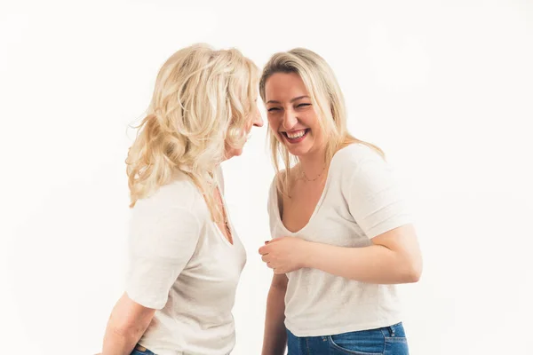 Overjoyed senior mother and adult daughter have fun enjoyin together, happy mature mom and grownup millennial girl child in a studio, feel excited and optimistic — Stock Photo, Image