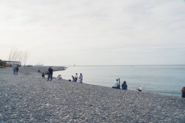 05.14.2022 - Gürcistan 'ın Batumi kentinde bulutlu bir havada Karadeniz plajında oturan Batumi, Adjara, Gürcistan. Yüksek kalite fotoğraf