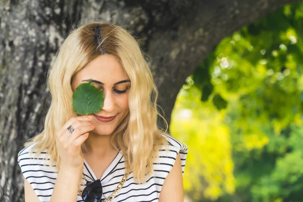 Blond Caucasian Girl Holding Small Green Leaf Close Eye Medium — Stock Photo, Image