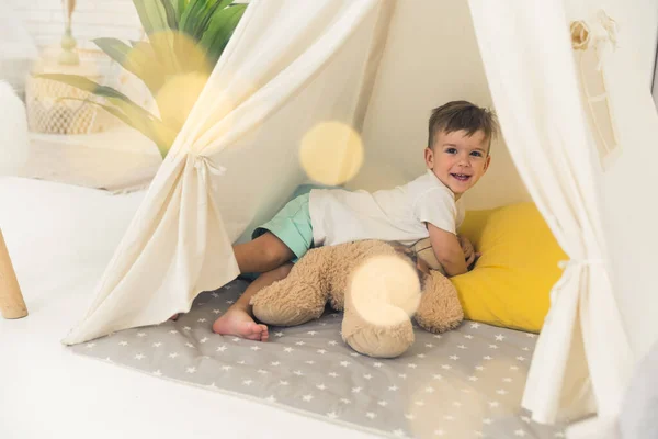 Cheerful Baby Boy Posing His Beloved Teddy Bear Tent Full — Photo