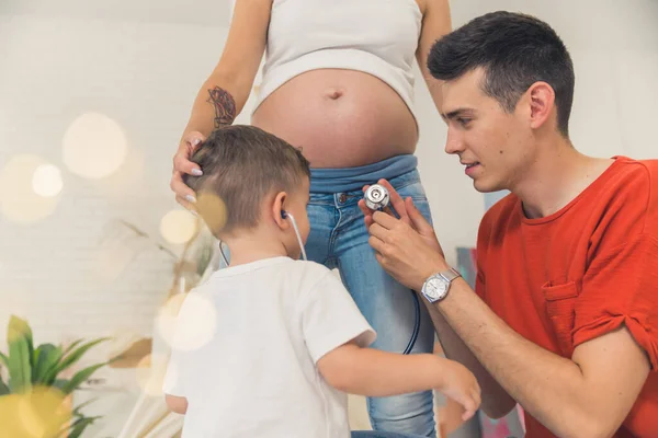 Young Man Helping His Son Listen Heartbeat Baby Belly His — Stok fotoğraf