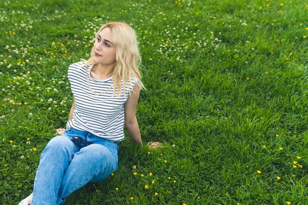 Blond Caucasian Girl Resting Green Grass Looking Medium Full Shot — Foto de Stock
