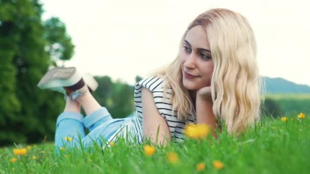 Blonde European Girl Lying Grass Looking Outdoor Full Shot High — Wideo stockowe