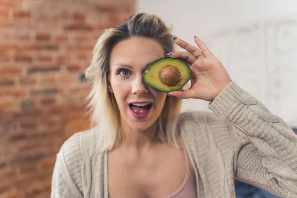 Excited Blond Caucasian Woman Ripe Delicious Avocado Home Medium Closeup — Stock Photo, Image
