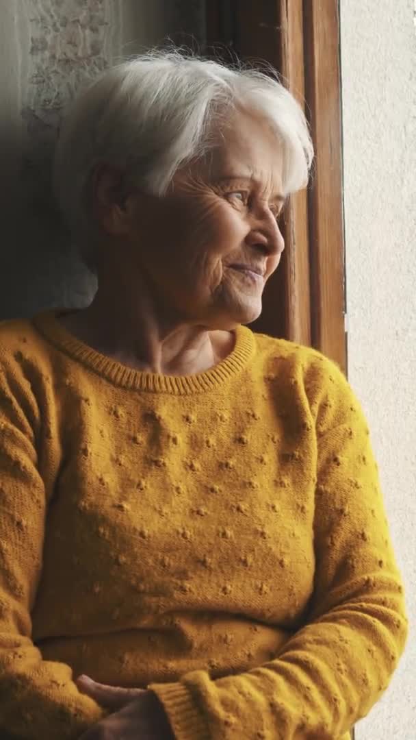 Elder Caucasian Woman Sitting Window Sill Looking Cowboy Shot Indoor — Stock Video