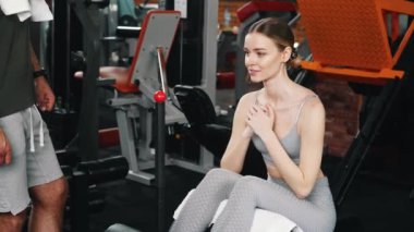 ABS exercise. Fit caucasian fashionable gym girl doing sit ups to train her core muscles. High quality 4k footage