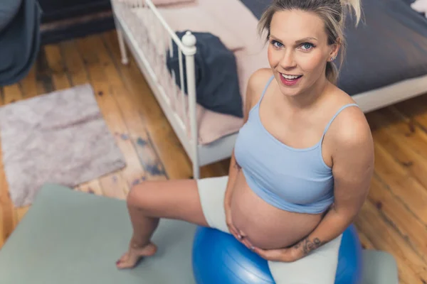 Young Blond Smiling Caucasian Pregnant Woman Sitting Fitball Bedroom Background — 스톡 사진