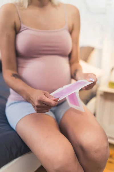 Pregnant Woman Using Pink Wax Stripes Woman Hygiene Concept Indoors — Stockfoto