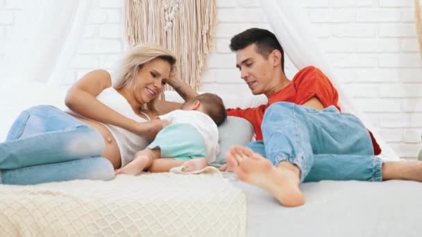 Happy Parenthood Childhood Cute Heterosexual Couple Laying Big White Sofa — Stock Video