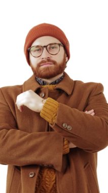 Pensive thoughtful Caucasian bearded man, thinking and looking to the camera isolated on white background Vertical. High quality 4k footage