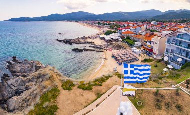 Sarti, Greece. Summer holidays in Greece. Beautiful seaside and beaches offered by the town of Sarti. Mountains in the background. High quality photo