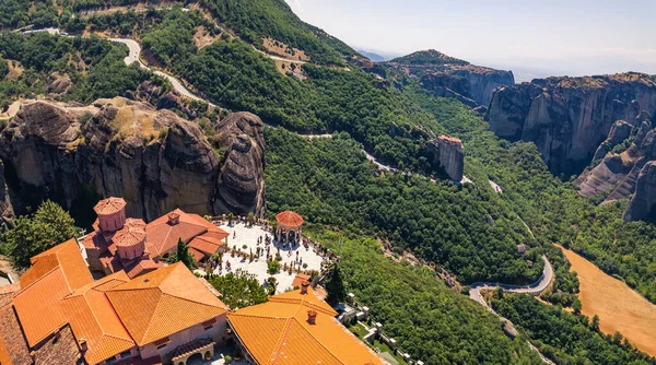 Nature and human concept. Aerial view showing tourists visiting one of the famous monasteries and enjoying beautiful view. High quality photo