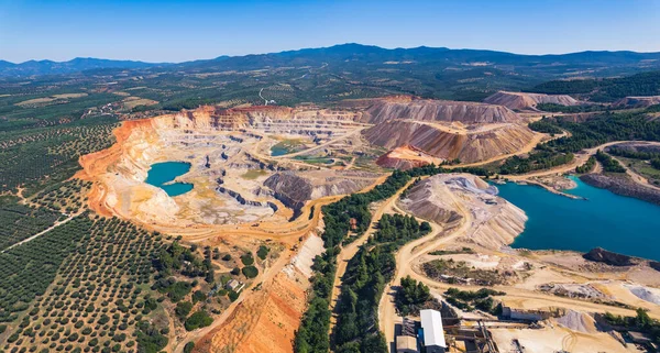 Open-pit mining concept. Drone aerial view of an open-pit mine in Greece. Human and environment concept. High quality photo