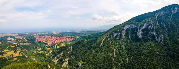 Mount Olympus, Greece. Long panoramic aerial drone shot at Leptokaria and Litochoro. Beautiful natural forests and cliff formations. High quality photo
