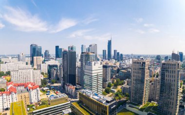 7.22.2022 Warsaw, Poland. Aerial Birds Eye View of Skyline in Warsaw. City life concept. Nearly clear blue sky. High quality photo