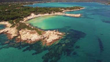 Drone aerial view of a beautiful turquoise-dark blue waters of Karydi Beach. Summer destination concept. High quality 4k footage