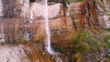 Scenic drone shot of a high cliff with an enormous waterfall, Okatse, Georgia, Europe. High quality 4k footage