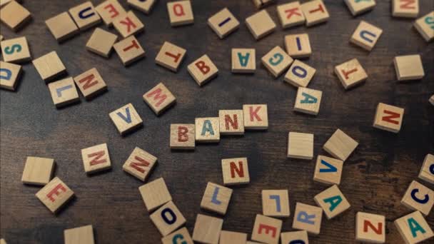 Bank Money Savings Concept Scattered Colourful Wooden Letter Puzzles Creating — Wideo stockowe