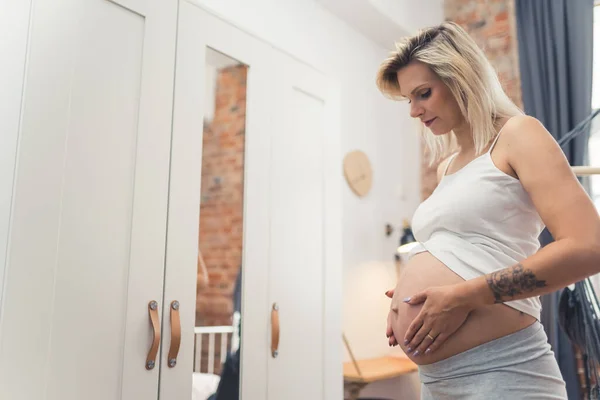 Young Pretty Caucasian Pregnant Woman Touching Her Belly Caring Her — Stock Fotó