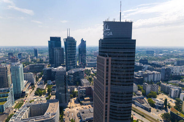 7.22.2022 Warsaw, Poland. Warsaw Trade Tower seen from in closeup thanks to the professional filming drone. Aerial cityscape. High quality photo