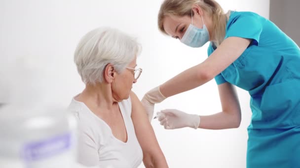 Elderly Worried Woman Getting Vaccinated Virus Protection Professional Nurse Hospital — стоковое видео
