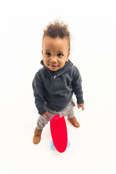 Positive Curly African American Toddler Standing Red Skateboard Looking Aside — Photo