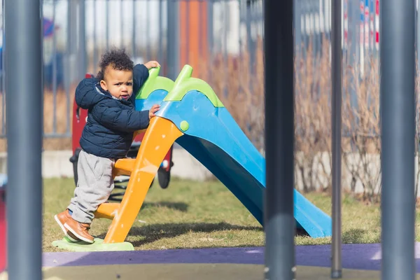 African American Kid Dreassed Winter Clothes Moving Slide Residence Playground — 图库照片