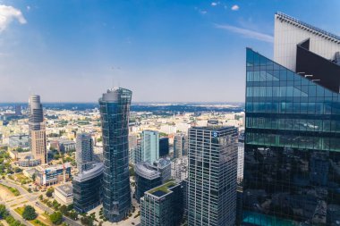 7.22.2022 Warsaw, Poland. Modern place of work concept. Offices in such skyscrapers as Skyliner and Warsaw Spire. Cityscape concept. High quality photo