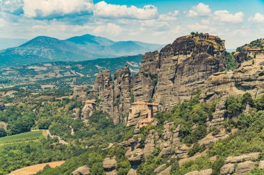 Touristic place to visit during summer holidays in Greece. The monasteries of Meteora built on the top of rock formations. High angle shot. High quality photo
