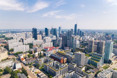 7.22.2022 Warsaw, Poland. Numerous buildings seen from aerial drone perspective - skyscrapers, blocks of flats, offices. High quality photo