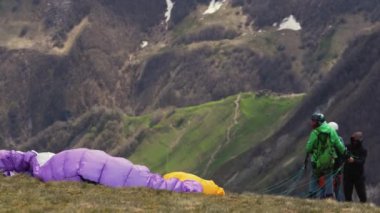 18.05.2022. Gudauri, Georgia. paraglider man getting ready for a flight. High quality 4k footage