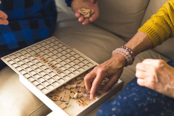 Senior European Married Couple Playing Board Game Building Words Board — Photo